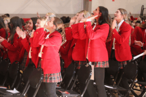 Ursuline Academy students singing at the Feast of St. Ursula Mass.
